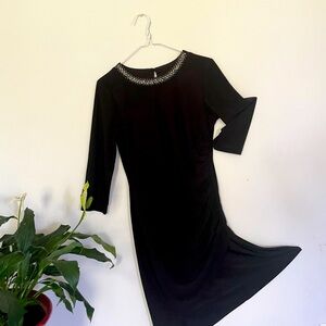 Beautiful Black Beaded neckline dress by Leslie Fay. This dress will go anywhere